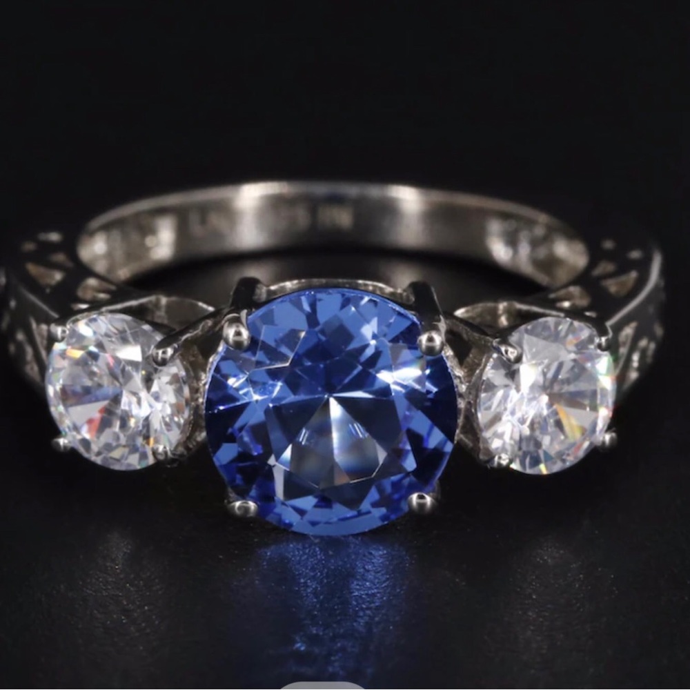 Sterling Topaz and Cubic Zirconia 3 stone ring.